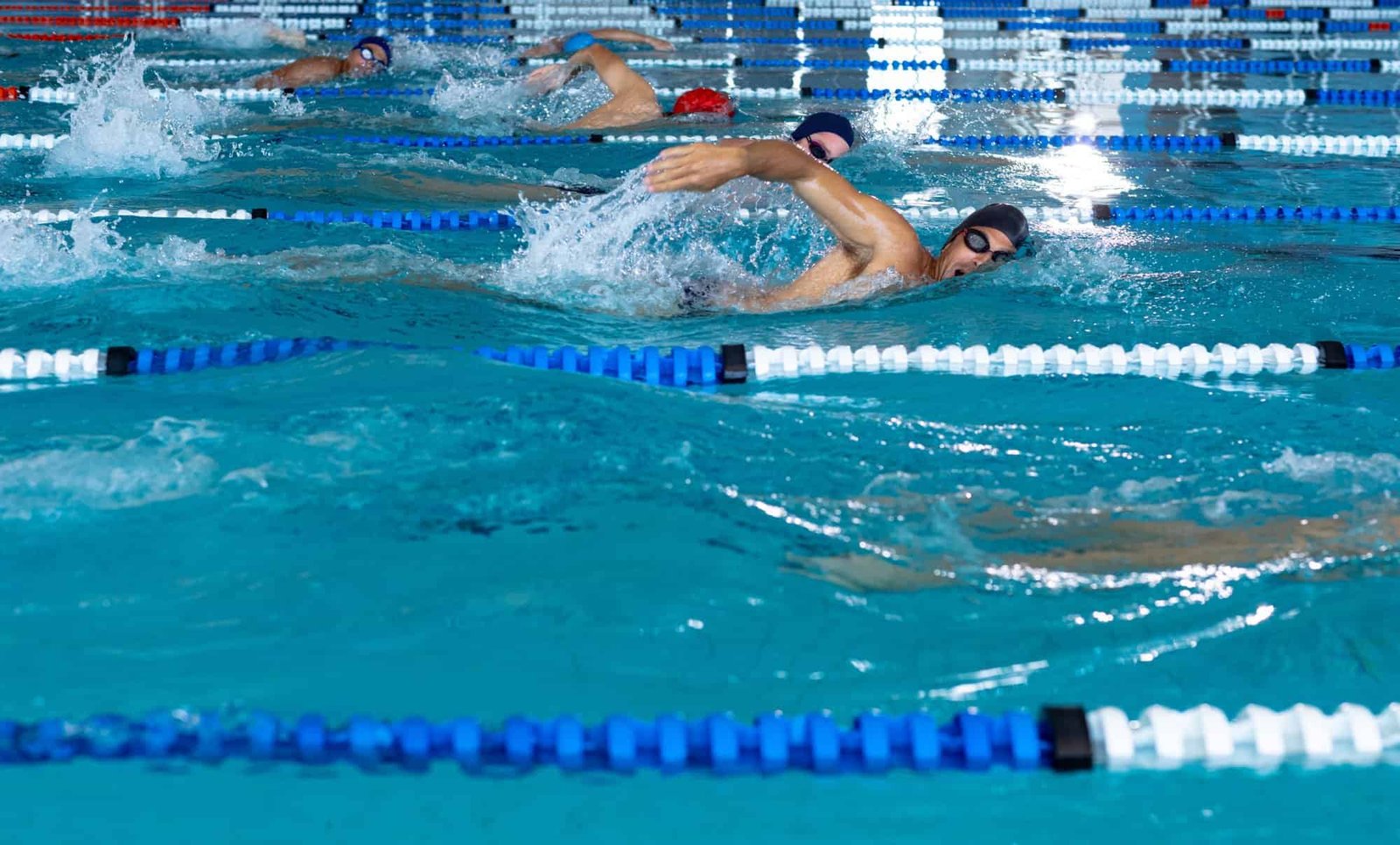 Swimmers swimming in the pool