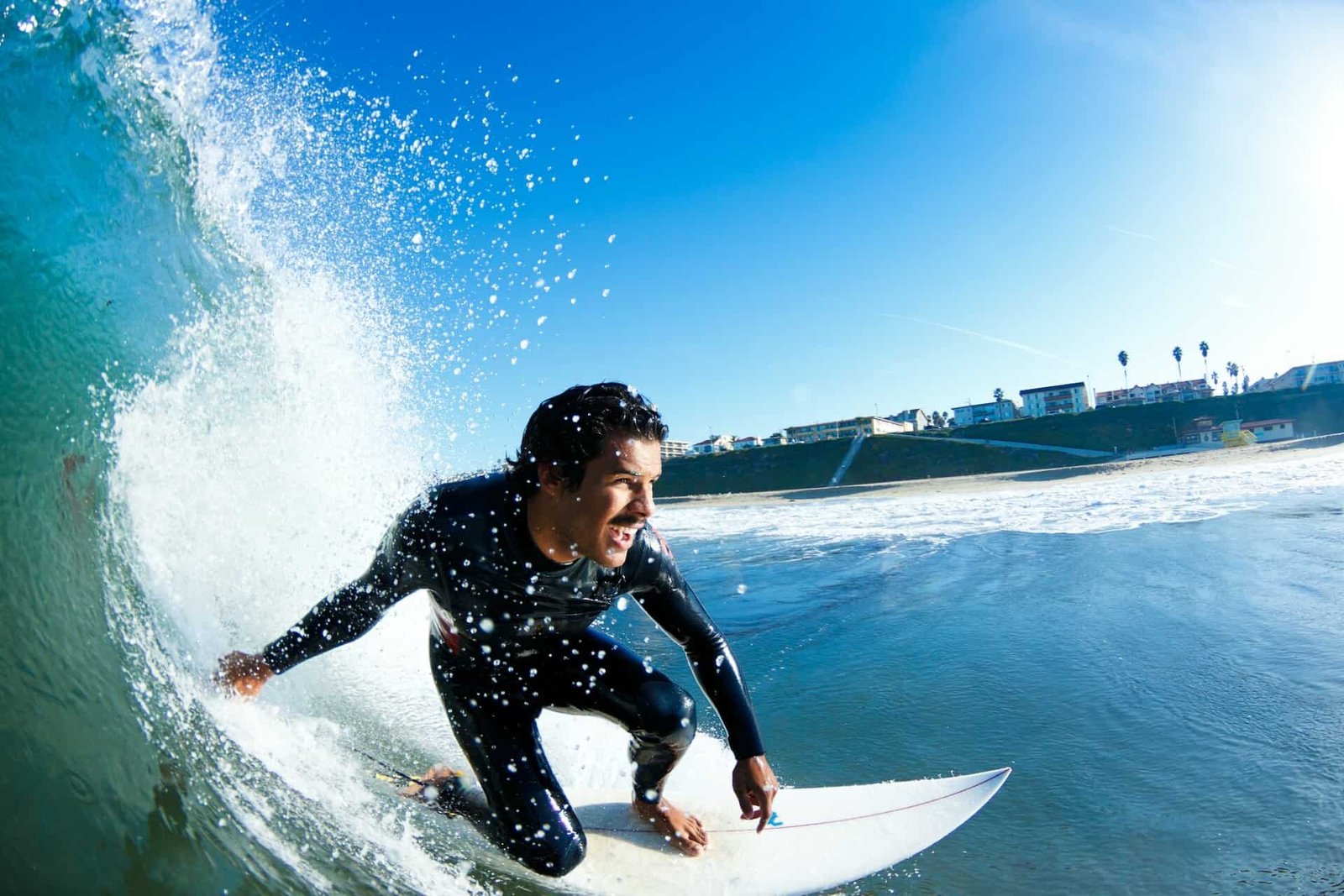 Surfer On Blue Ocean Wave